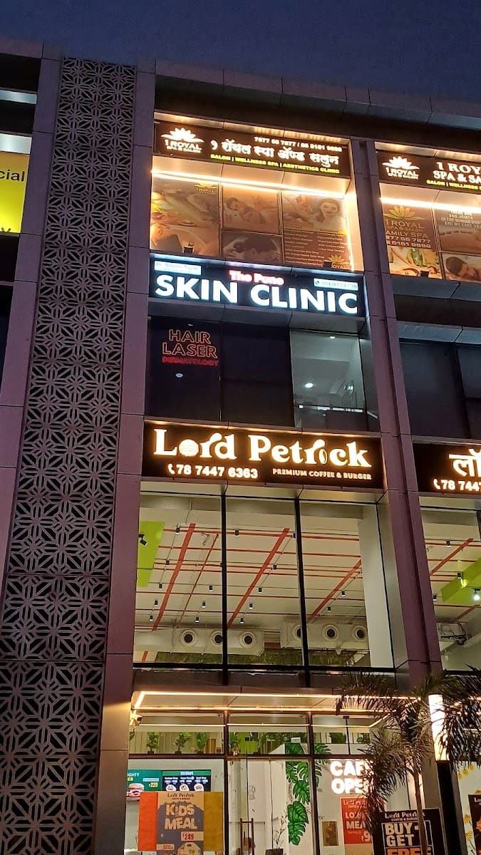 The SKIN CLINIC signboard lit at night at WBiz Mall